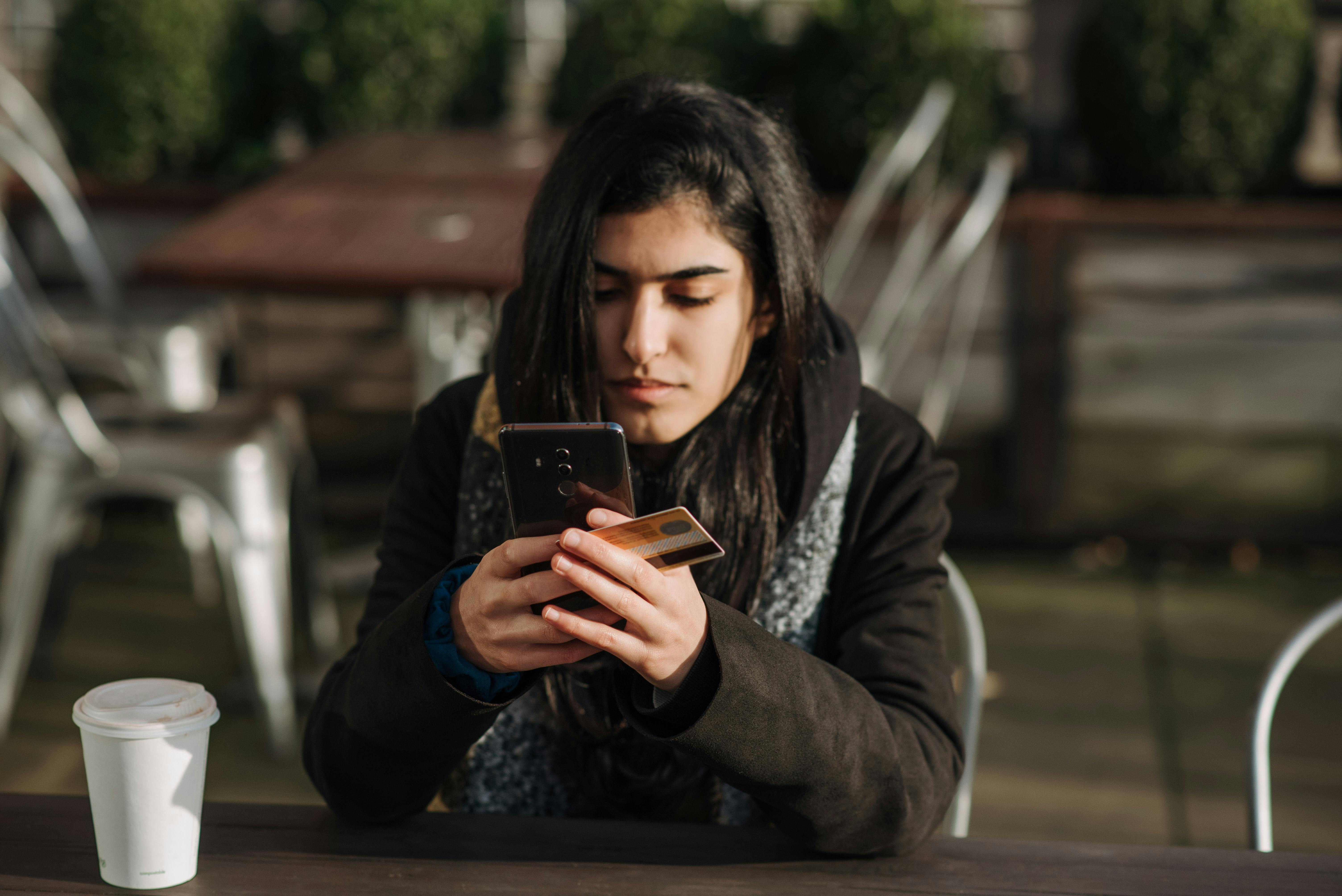 User completing an overseas online payment with a bank card on a smartphone