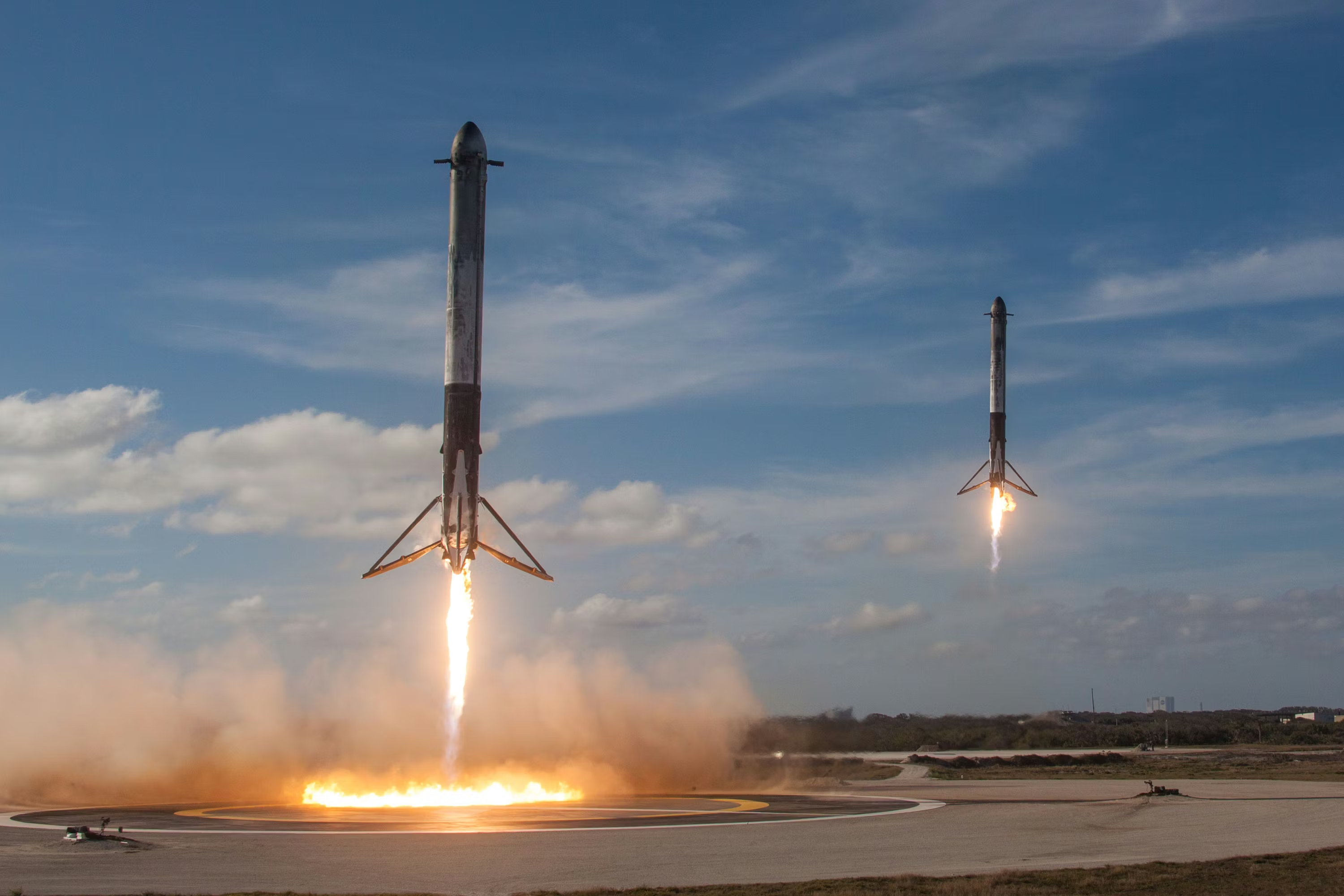 Two Falcon 9 boosters returning simultaneously, showing SpaceX’s rocket recovery capability