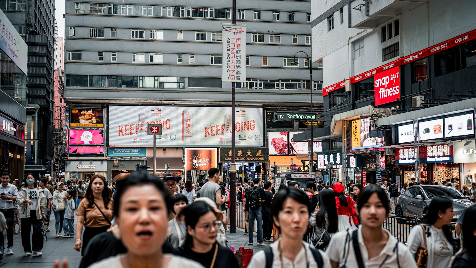 Hong Kong street currency exchange scene with HKD and RMB context