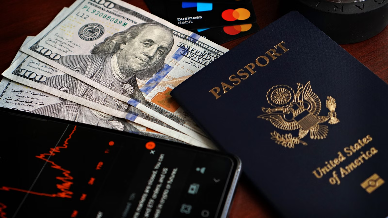 Travel payment card, passport and cash for cross-border spending