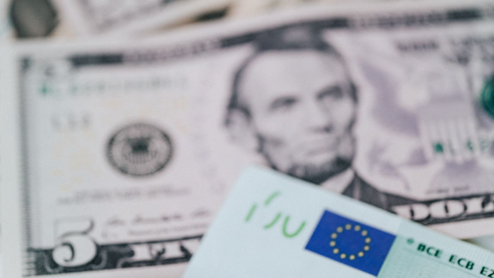 A close-up of US dollar and euro banknotes illustrating bank cash exchange