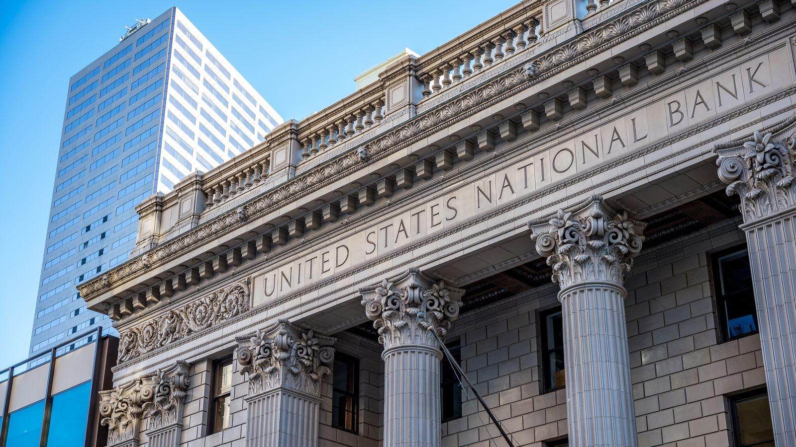 The exterior of a bank building, illustrating the fiat payment and bank receipt stage