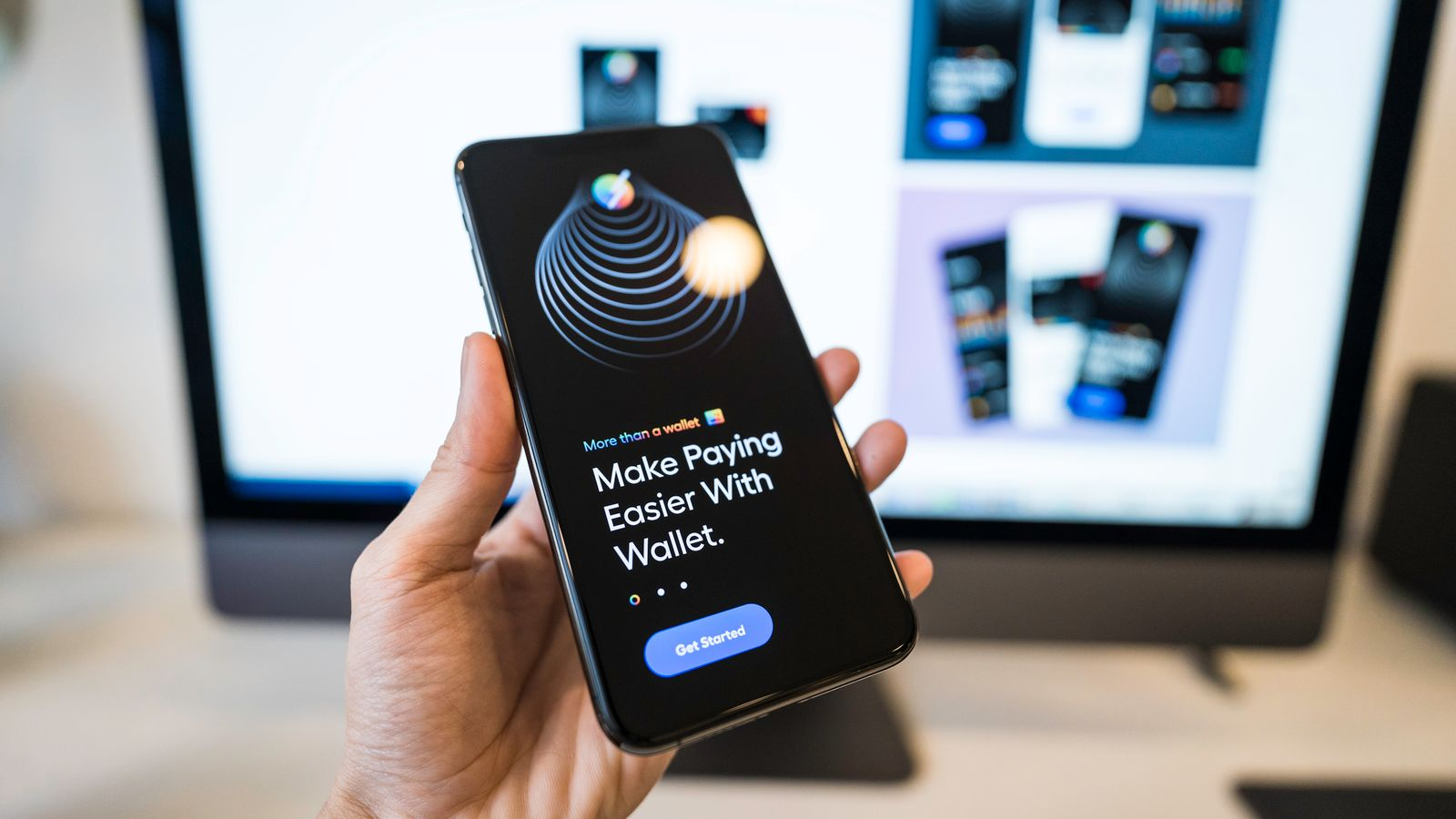 A phone displaying an introduction to a digital wallet app