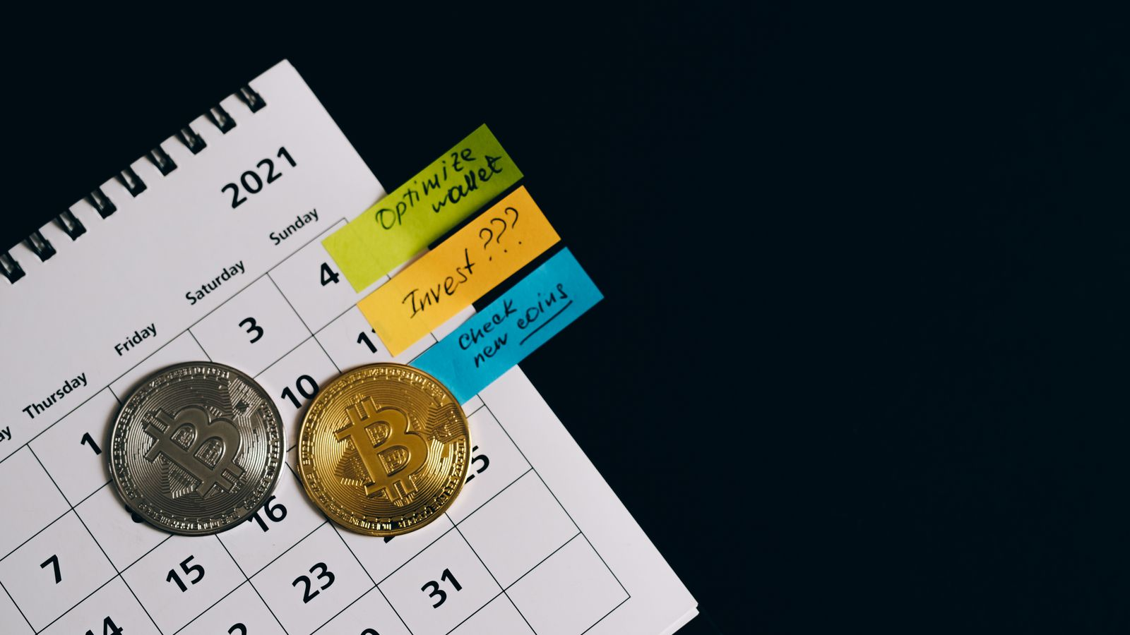 Bitcoin models on a calendar illustrate scheduled contributions