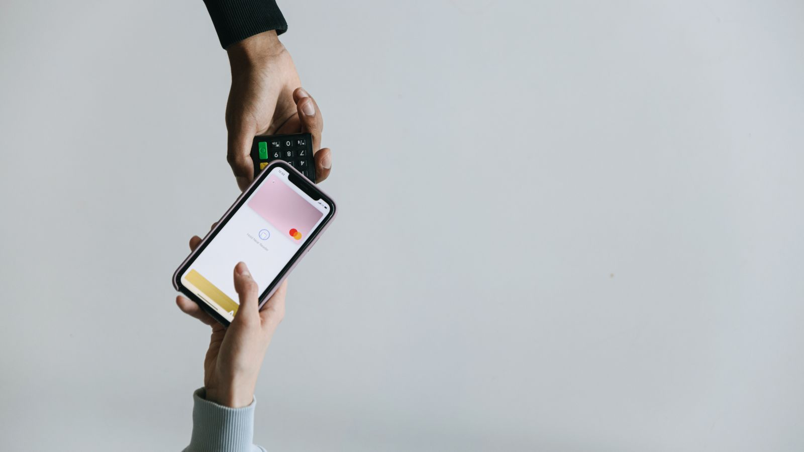 A contactless payment using a phone and payment terminal, illustrating a general payment scenario rather than a specific platform's features